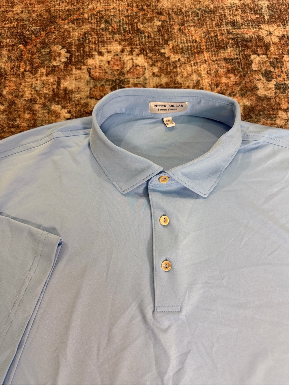 Peter Millar light blue golf polo shirt with crown emblem on the back size XL